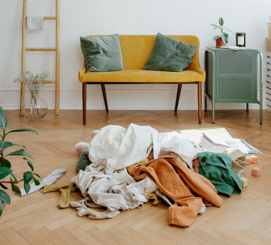 messy pile of clothes on floor